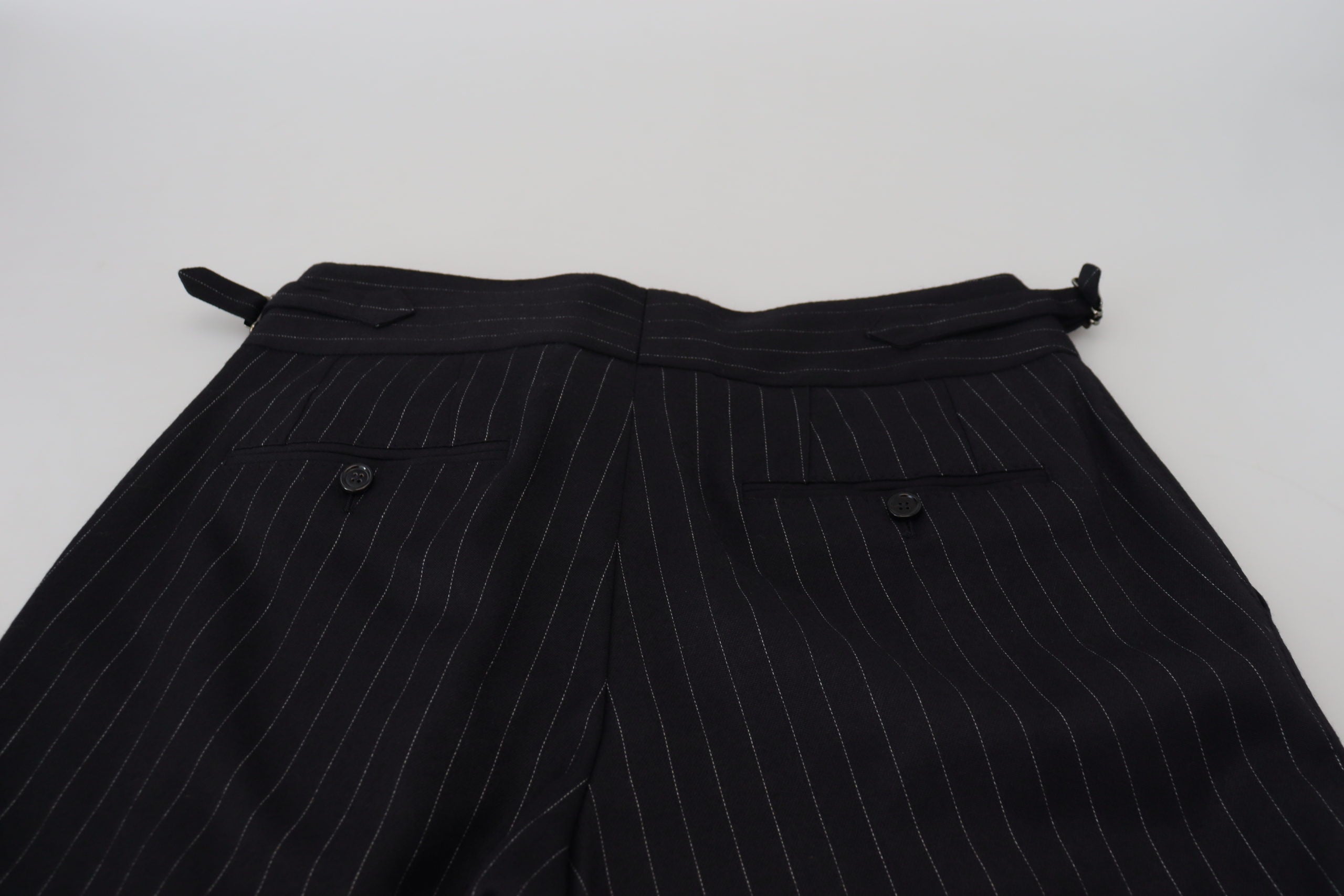 Black wool striped chino pants by Dolce & Gabbana, featuring tailored fit and classic pattern, shown on a model.
