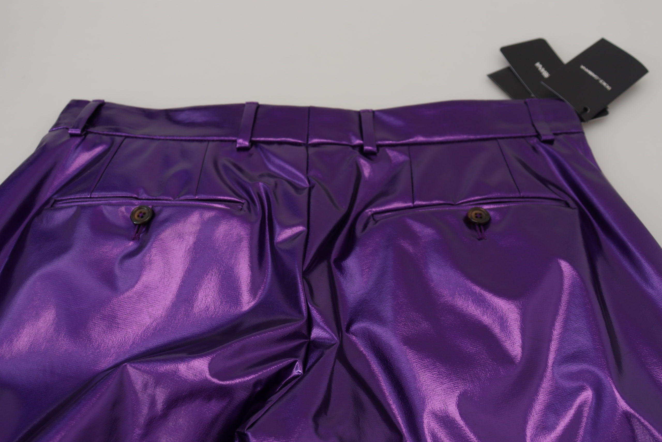 Purple shining men's casual pants by Dolce & Gabbana, featuring a sleek, glossy fabric and stylish fit.