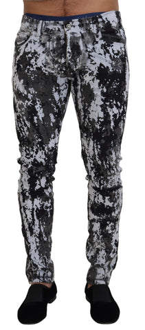Multicolor cotton tie-dye skinny denim jeans by Dolce & Gabbana featuring vibrant patterns and classic denim styling.