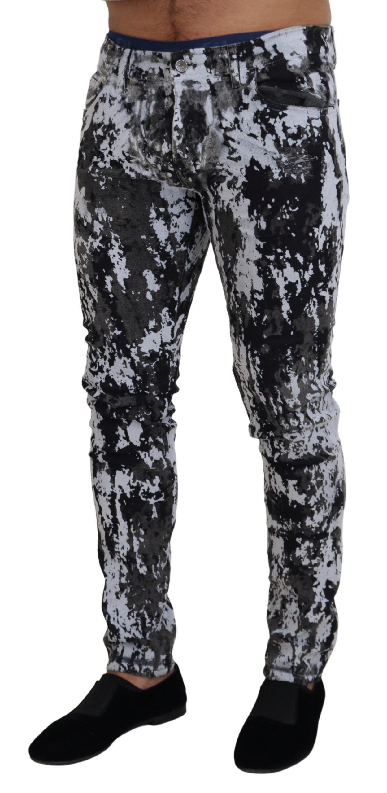 Multicolor cotton tie-dye skinny denim jeans by Dolce & Gabbana, showing vibrant pattern and fitted style.