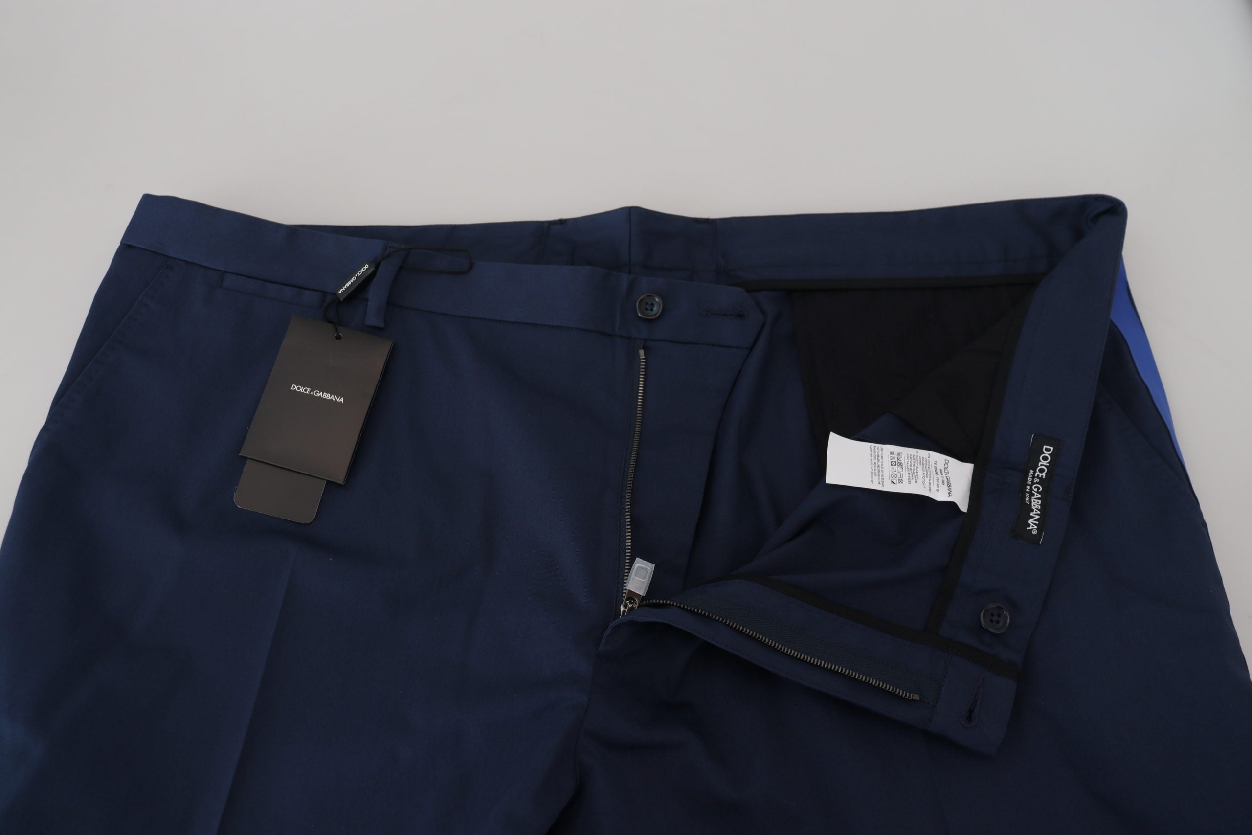 Blue cotton men's cropped pants by Dolce & Gabbana displayed on a model, showcasing a relaxed fit and stylish design.