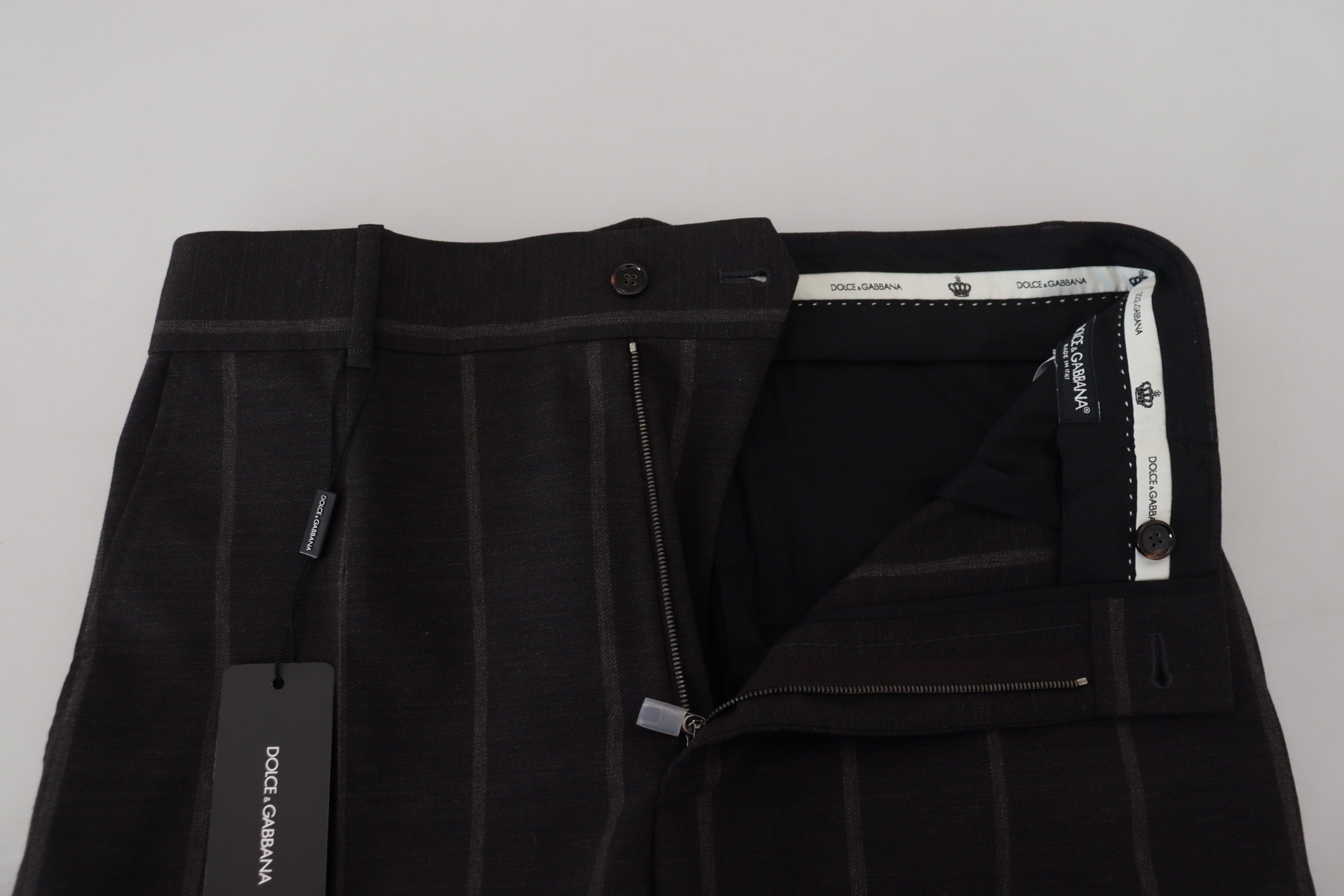 Black wool chino formal men's pants by Dolce & Gabbana, tailored fit with classic design and belt loops.