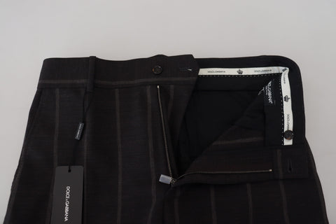 Black wool chino formal men's pants by Dolce & Gabbana, tailored fit with classic design and belt loops.
