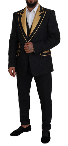 Black gold fantasy tuxedo slim fit suit by Dolce & Gabbana, featuring a tailored black tuxedo jacket with gold accents and sleek design.