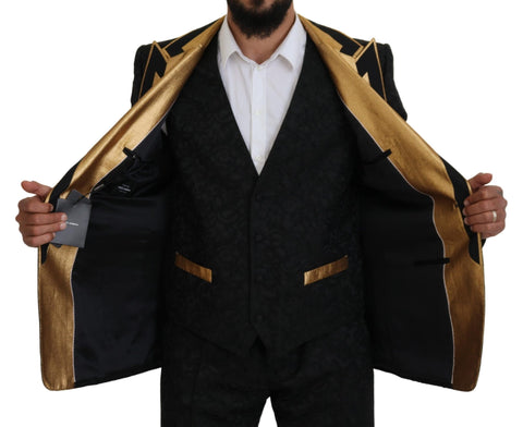 Black gold fantasy tuxedo slim fit suit by Dolce & Gabbana, featuring a stylish black and gold design with tailored fit, displayed on a mannequin.