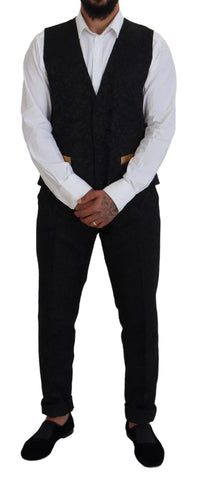 Dolce & Gabbana black gold fantasy tuxedo slim fit suit, tailored formal men's attire with gold accents, front view.