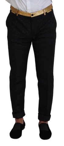 Black gold fantasy tuxedo slim fit suit by Dolce & Gabbana, featuring a sleek black fabric with gold accents and tailored fit.