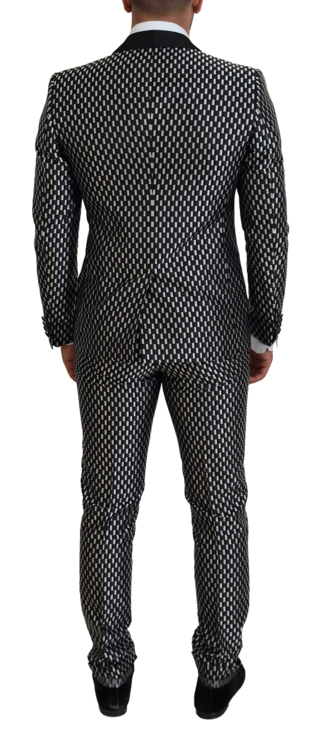 Black and white silk Martini slim fit suit by Dolce & Gabbana, tailored with sharp lapels and a sleek, modern design.