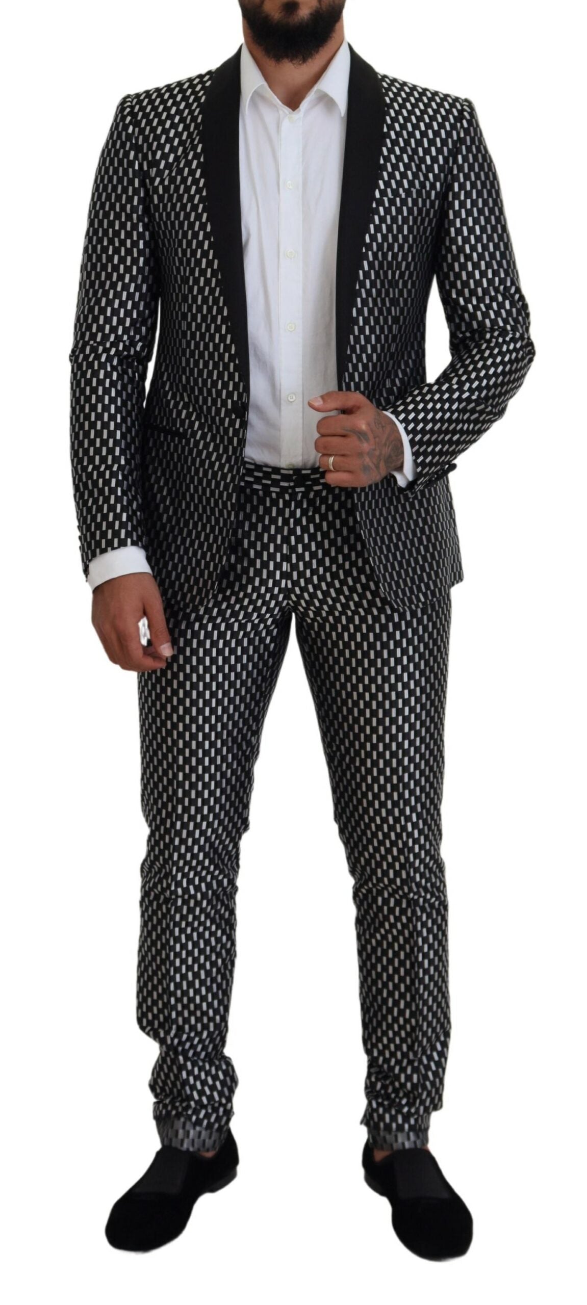 Black and white silk Martini slim fit suit by Dolce & Gabbana, shown on a mannequin with tailored details and sleek design.