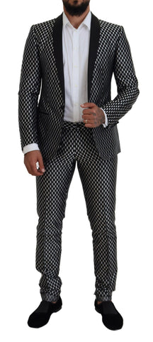 Black and white silk Martini slim fit suit by Dolce & Gabbana, shown on a mannequin with tailored details and sleek design.