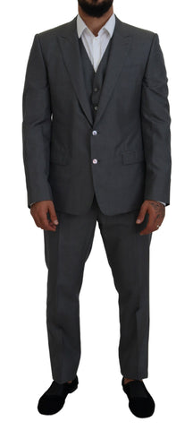 Gray Dolce & Gabbana Martini 3-piece slim fit suit displayed on a mannequin, showcasing tailored jacket, vest, and trousers.