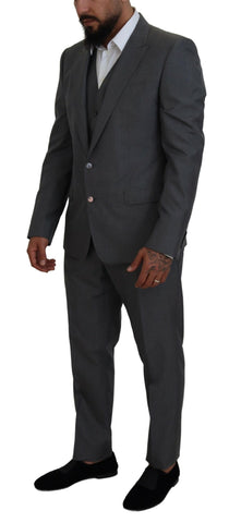 Gray Dolce & Gabbana Martini 3-piece slim fit suit displayed on a mannequin with matching trousers, blazer, and vest.