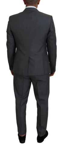 Gray Dolce & Gabbana Martini 3-piece slim fit suit displayed on a mannequin, featuring a tailored jacket, vest, and matching trousers.