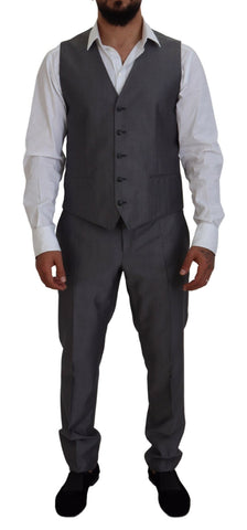 Gray Sicilia 3-piece slim fit suit by Dolce & Gabbana, featuring tailored jacket, vest, and matching trousers on a model.