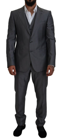 Gray Dolce & Gabbana Sicilia 3-piece slim fit suit, featuring tailored jacket, trousers, and vest on a hanger.