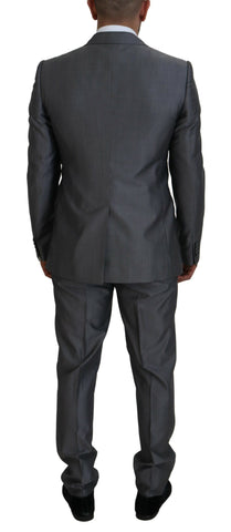 Gray Dolce & Gabbana Sicilia 3-piece slim fit suit displayed on a mannequin, featuring a tailored jacket, vest, and trousers.
