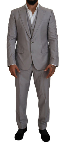 Silver wool silk 3-piece slim fit suit by Dolce & Gabbana, featuring tailored jacket, trousers, and vest on a mannequin.