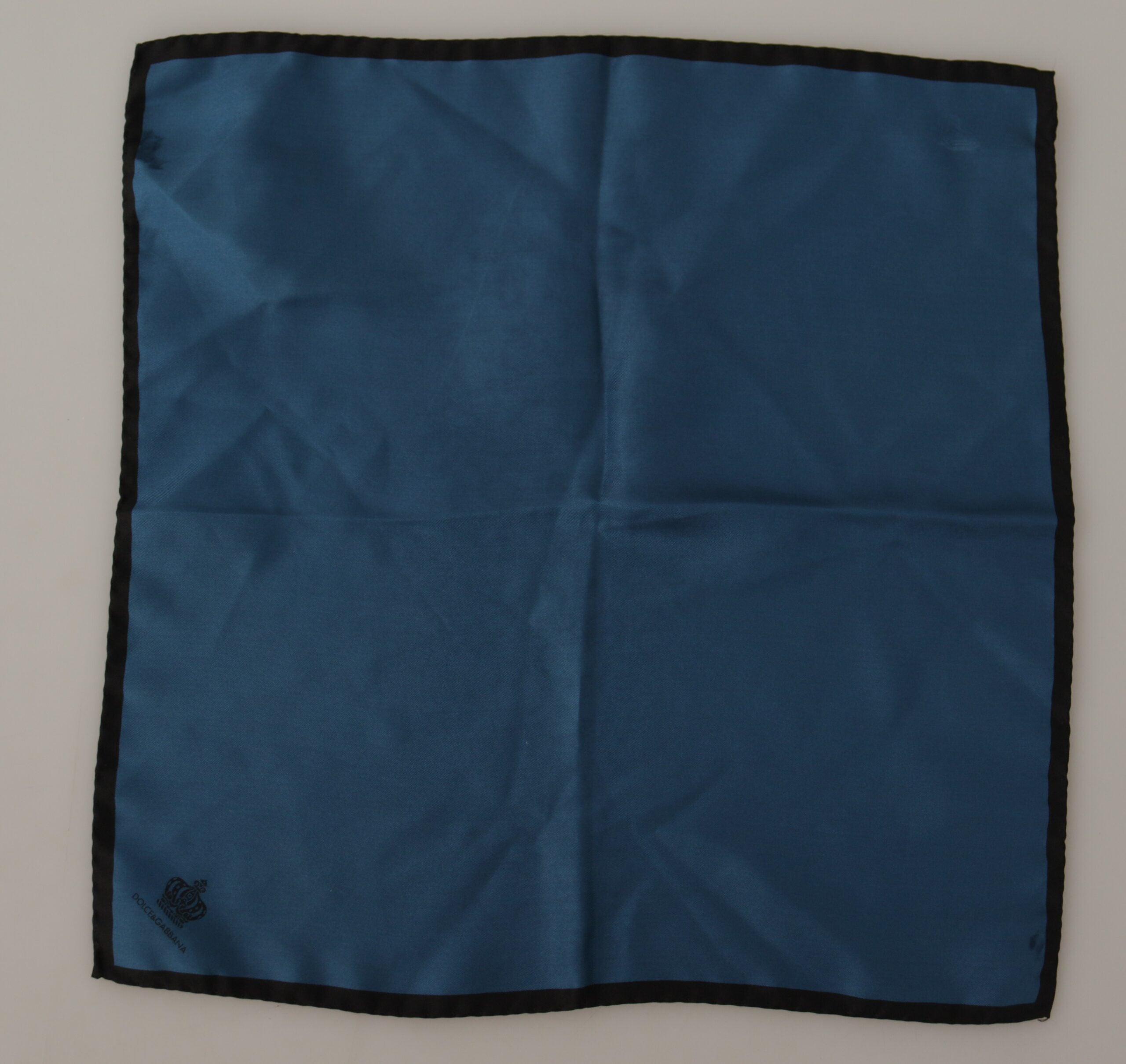 Black and blue Dolce & Gabbana crown printed square handkerchief scarf with intricate design and soft fabric.