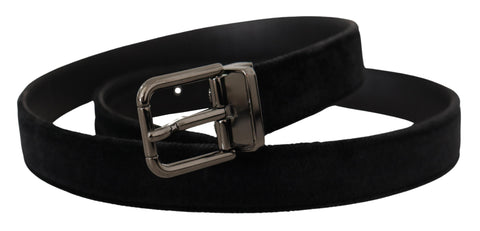 Black velvet belt with silver-tone metal buckle featuring Dolce & Gabbana logo, showcasing a stylish accessory for formal or casual wear.