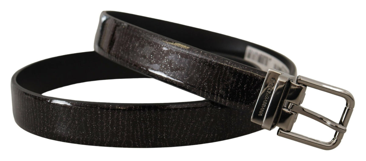 Black leather belt with a glossy vernice finish and a metal buckle, designed by Dolce & Gabbana.
