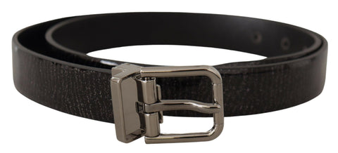 Black leather belt with a shiny metal buckle from Dolce & Gabbana, featuring a sleek Vernice finish and classic design.