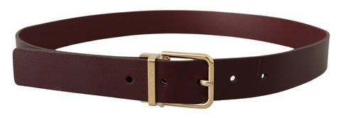 Maroon Vitello leather belt with gold metal buckle by Dolce & Gabbana, featuring a sleek and stylish design.