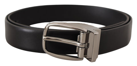 Black leather belt with silver metal chrome logo buckle from Dolce & Gabbana, featuring a sleek, stylish design.