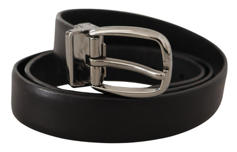Black leather belt with chrome logo metal buckle by Dolce & Gabbana, featuring a sleek design and polished finish.