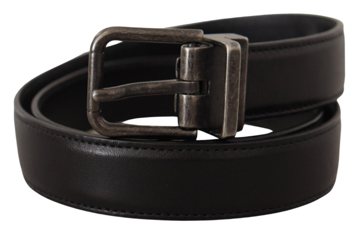 Black calf leather belt with silver logo metal buckle by Dolce & Gabbana, featuring a sleek design and adjustable strap.