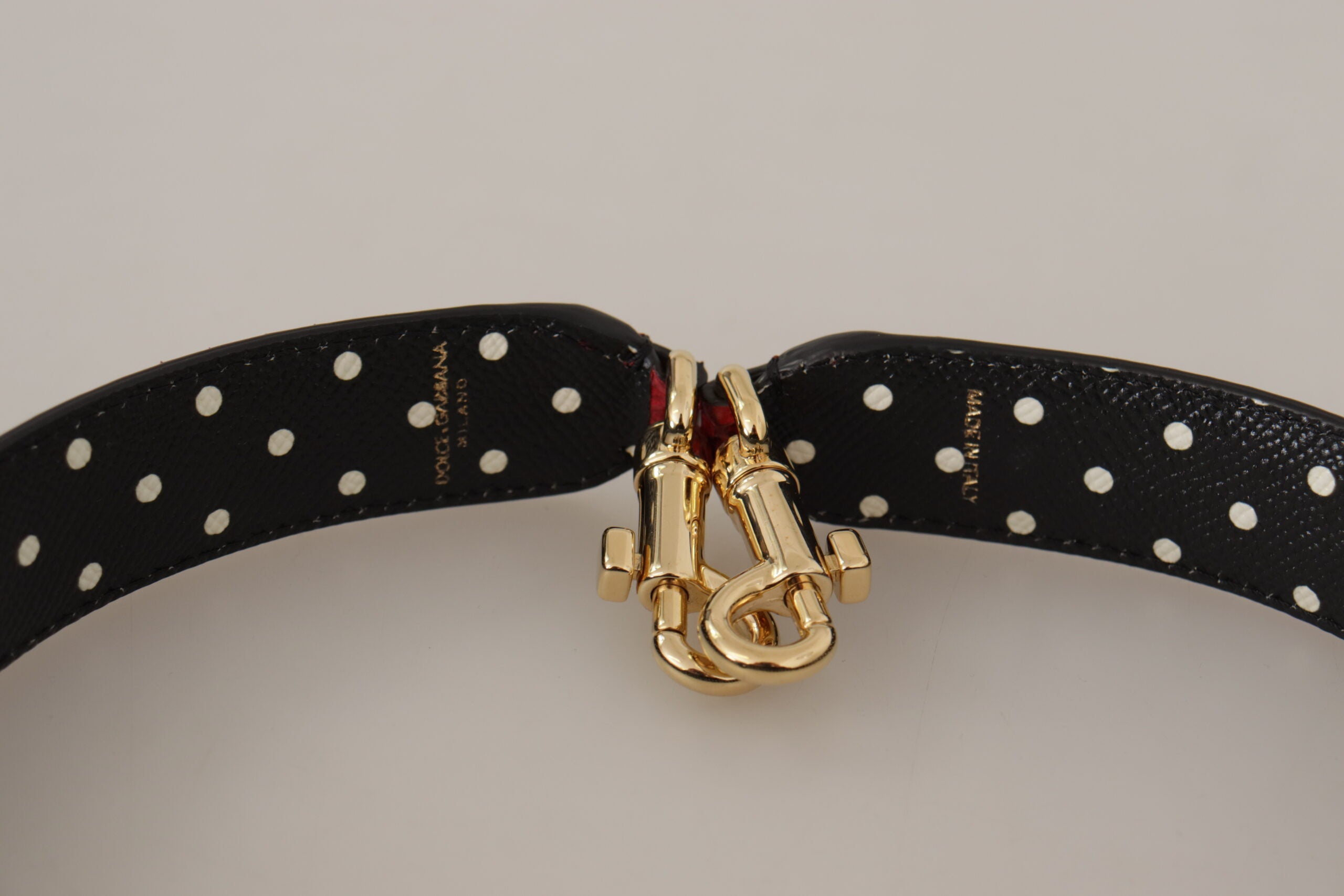 Red exotic leather shoulder strap with crystal embellishments for Dolce & Gabbana bags, featuring luxurious craftsmanship and vibrant detail.