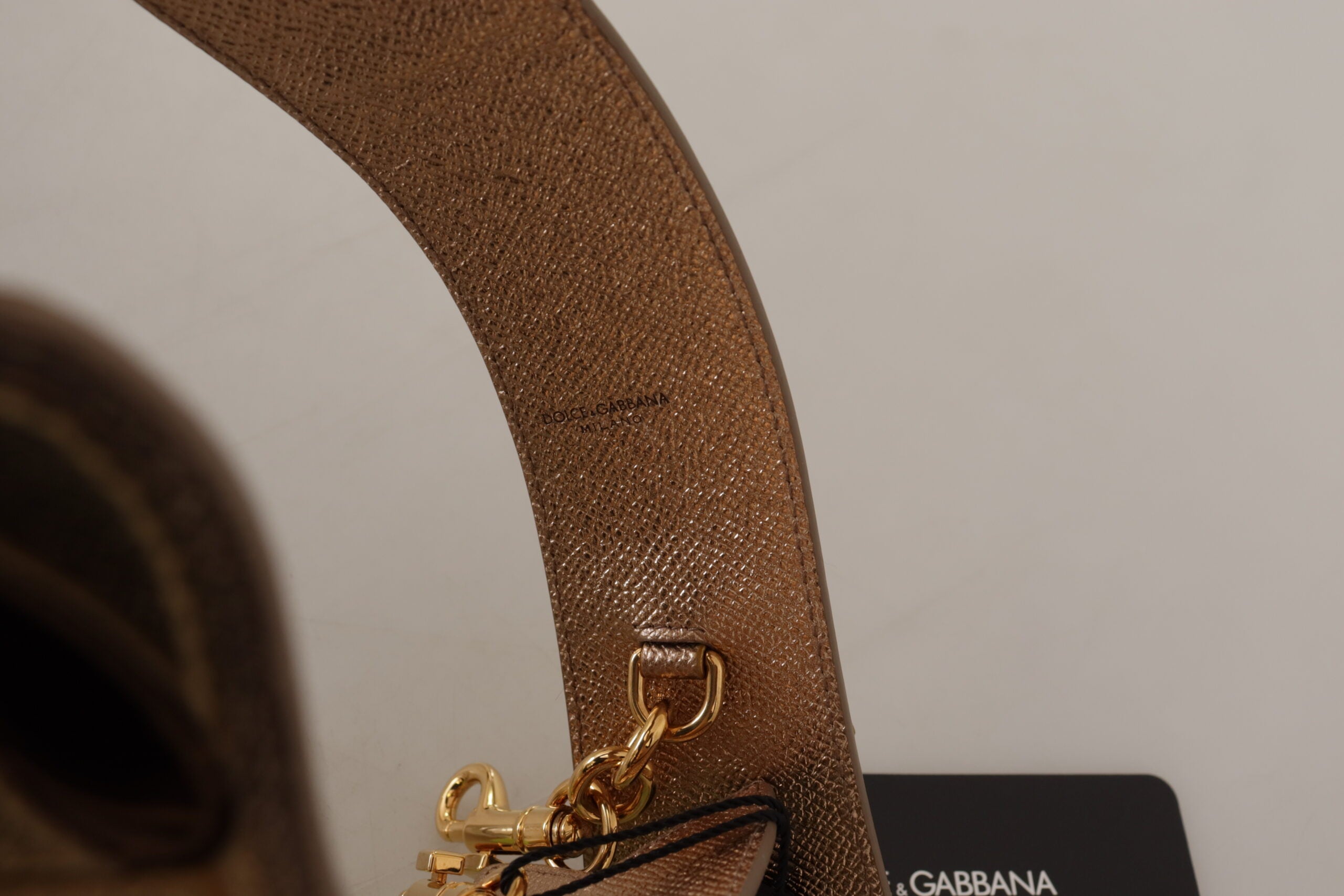 Gold leather LOVE patch bag shoulder strap by Dolce & Gabbana, featuring a stylish gold leather design and bold LOVE patch detail.