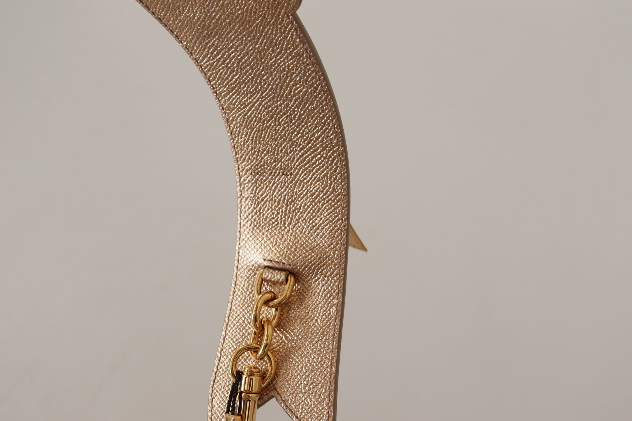 Gold leather shoulder strap with LOVE patch from Dolce & Gabbana, designed for bag customization and stylish accessories.