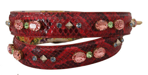 Red exotic leather Dolce & Gabbana reversible shoulder strap with crystal embellishments, showcasing luxurious craftsmanship and vibrant color.