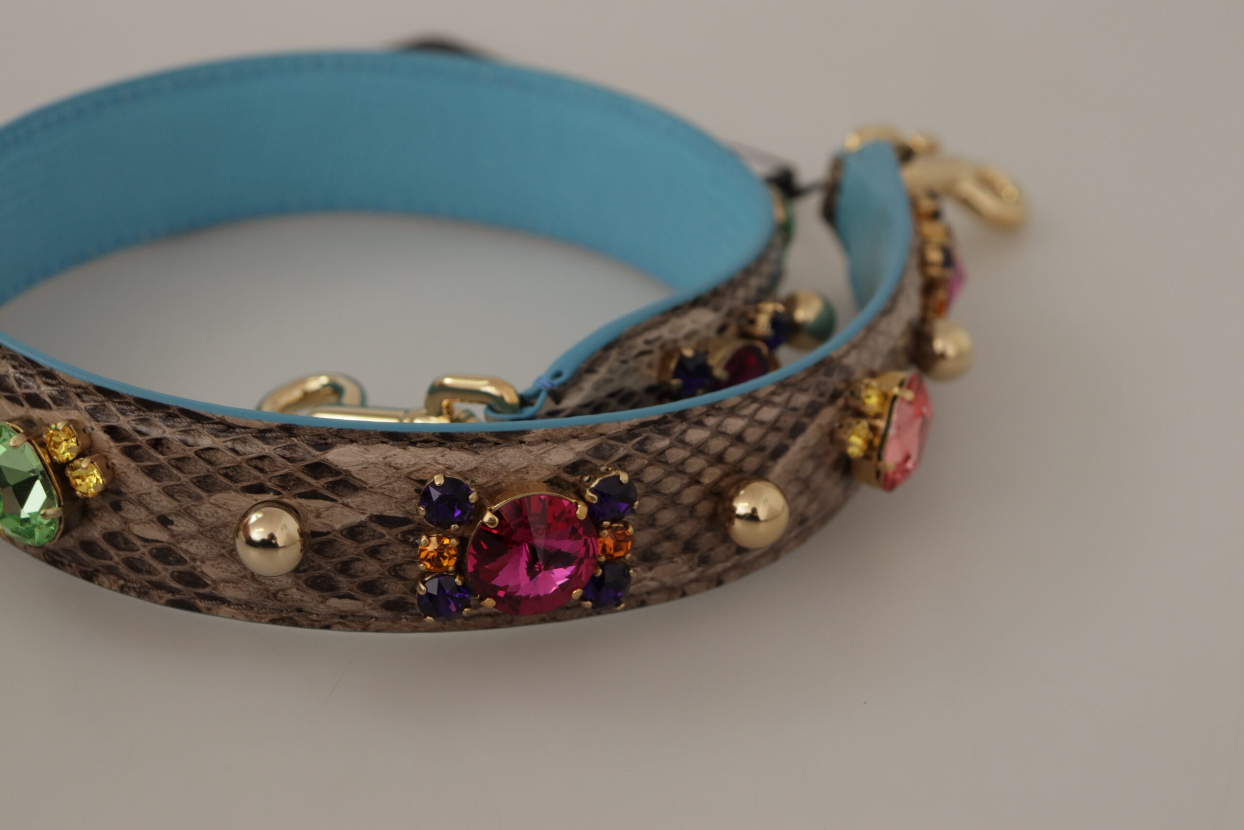 Brown exotic leather shoulder strap with crystal embellishments by Dolce & Gabbana, featuring detailed craftsmanship and luxurious design.
