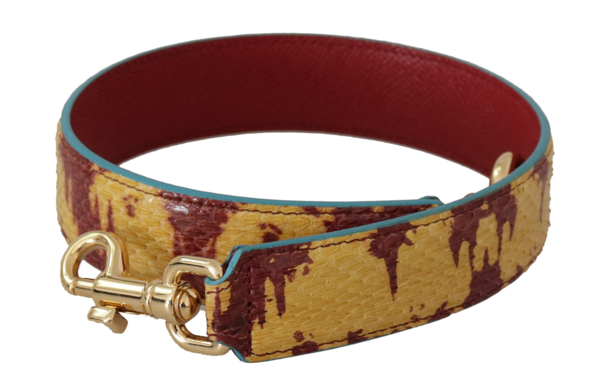 Yellow and red leather shoulder strap with gold tone hardware from Dolce & Gabbana, showing detailed stitching and metallic accents.