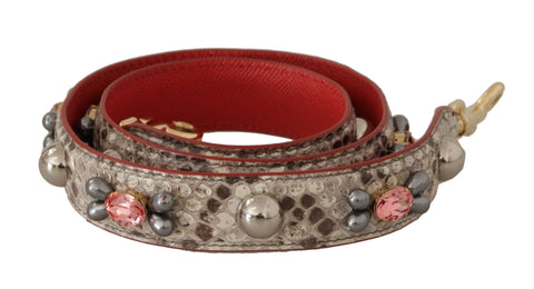 Beige exotic leather shoulder strap with studded details from Dolce & Gabbana, showing textured leather and metal studs.