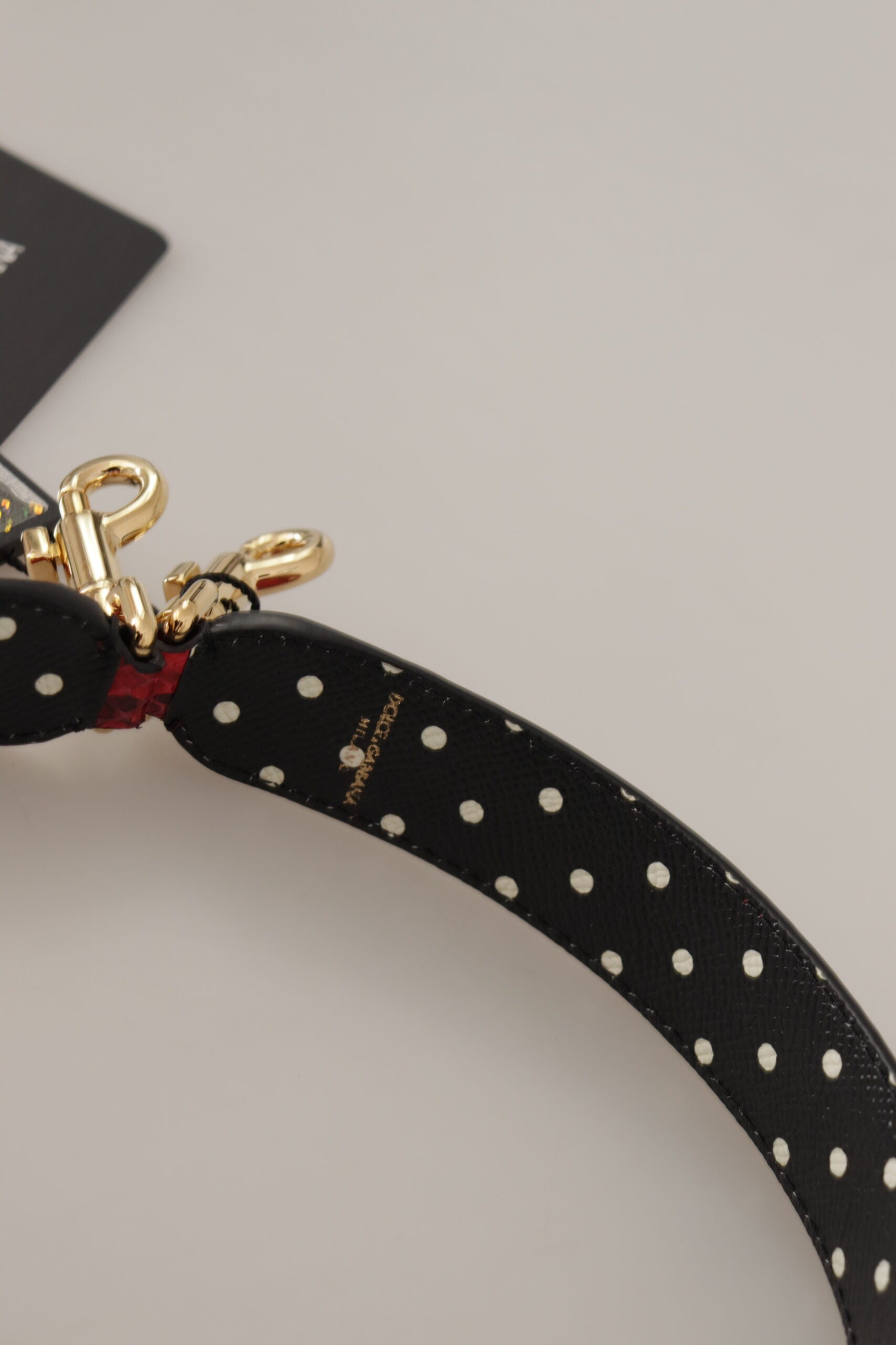 Red Python leather Dolce & Gabbana reversible shoulder strap with crystal embellishments, designed for stylish handbags.