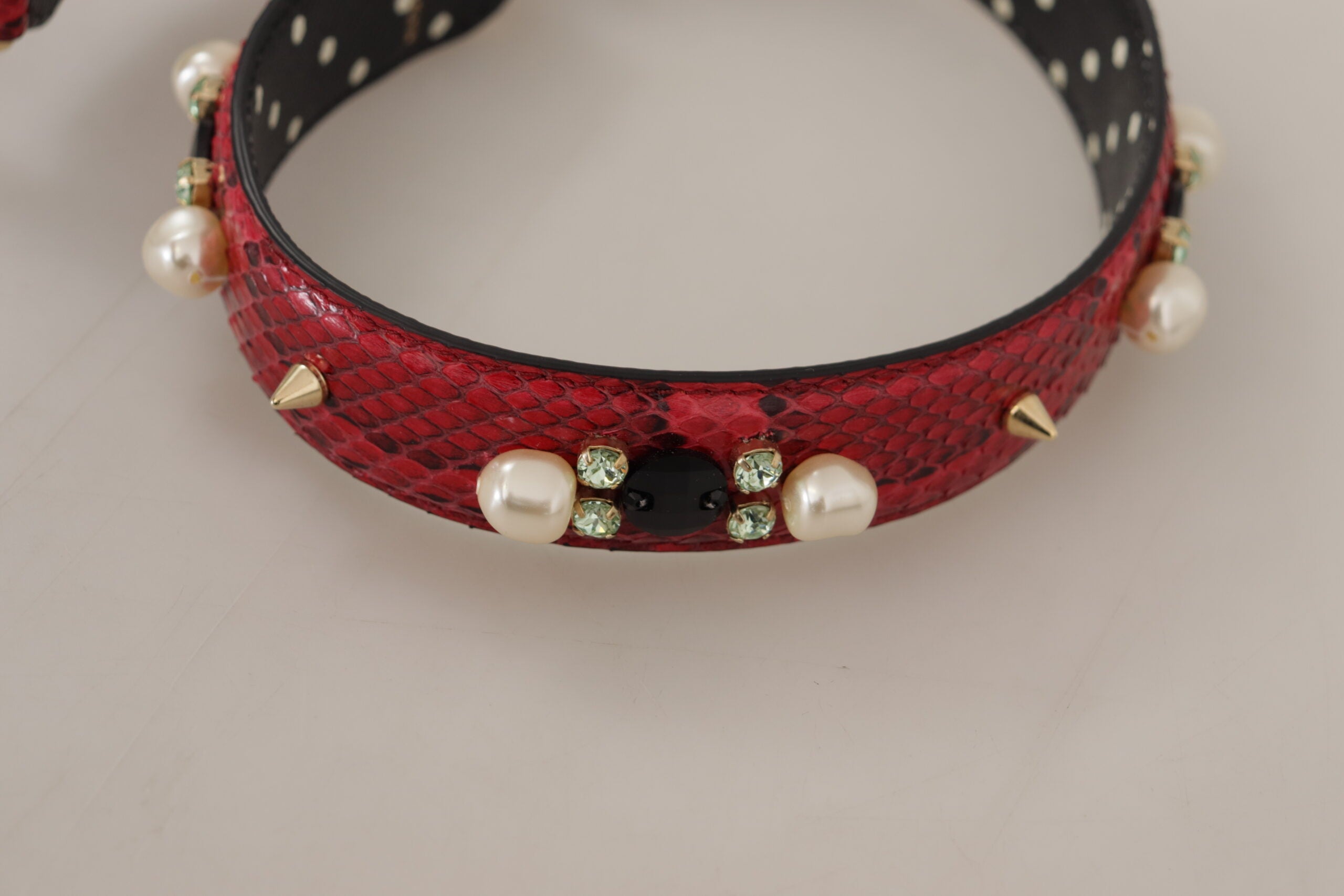 Red Python leather Dolce & Gabbana reversible shoulder strap with crystal embellishments and adjustable hardware.
