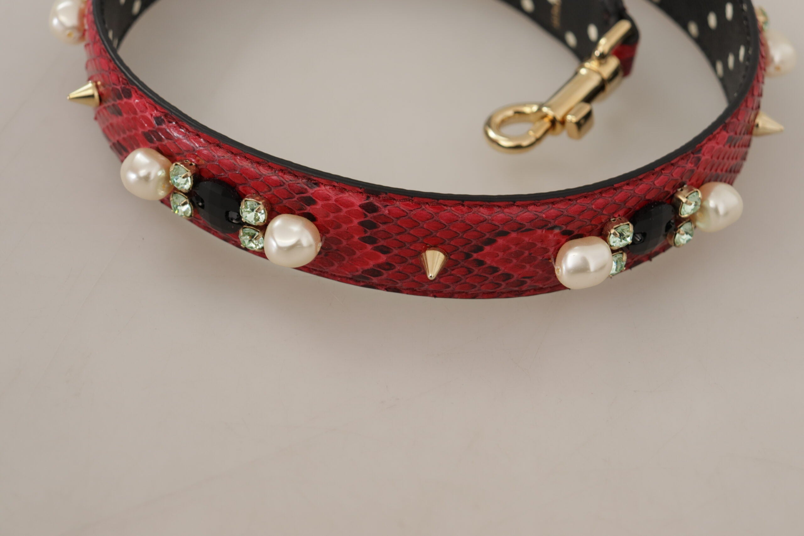 Red Python leather Dolce & Gabbana reversible shoulder strap with crystal embellishments, stylish and adjustable for luxury handbags.