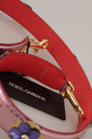 Metallic pink leather shoulder strap with stud detailing from Dolce & Gabbana, showcasing textured leather and silver-tone studs.