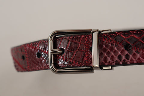 Red exotic leather belt with metal logo buckle by Dolce & Gabbana, featuring a sleek and luxurious design.