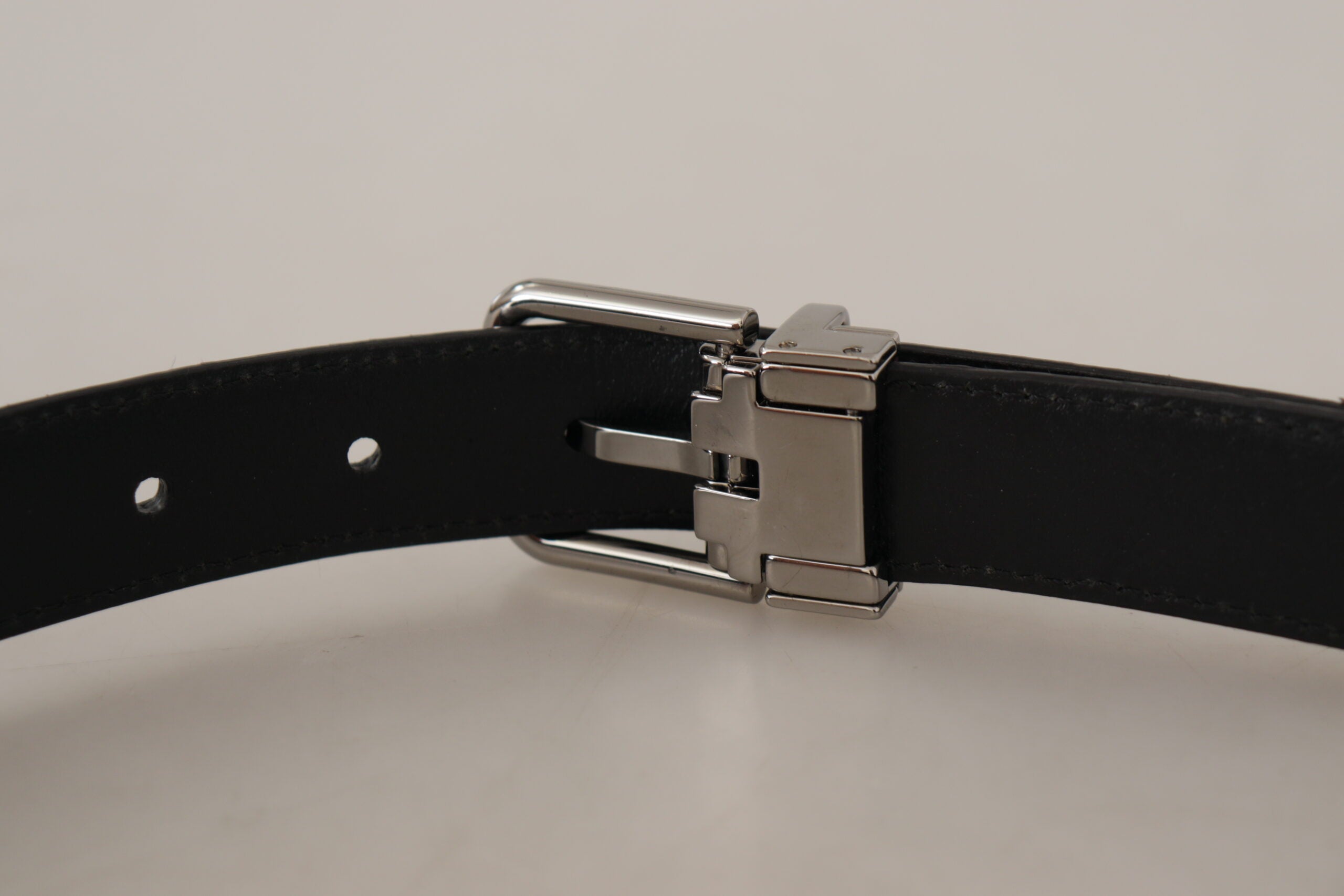 Red exotic leather belt with metal logo buckle from Dolce & Gabbana, featuring textured leather and sleek design.