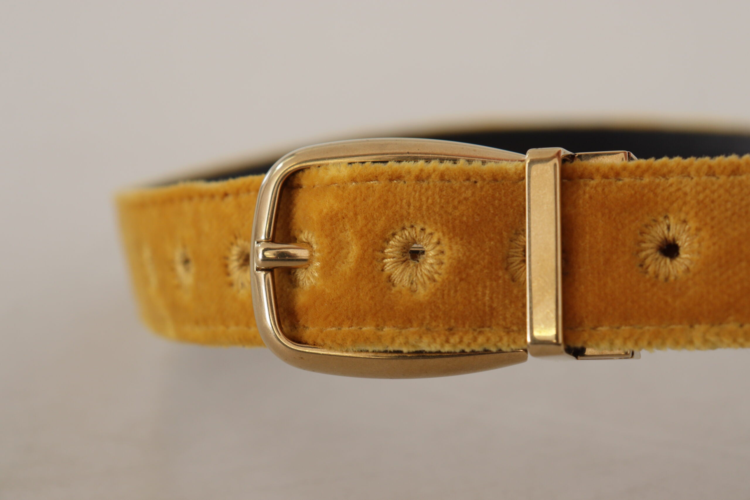 Dolce & Gabbana mustard velvet belt with gold logo engraved metal buckle, stylish accessory for versatile fashion looks.