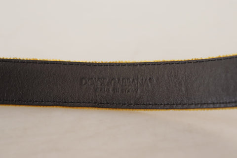 Dolce & Gabbana mustard velvet belt with gold logo engraved metal buckle, stylish accessory with luxury branding.
