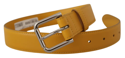 Yellow leather belt with silver tone logo metal buckle by Dolce & Gabbana, showing the detailed buckle and smooth leather strap.
