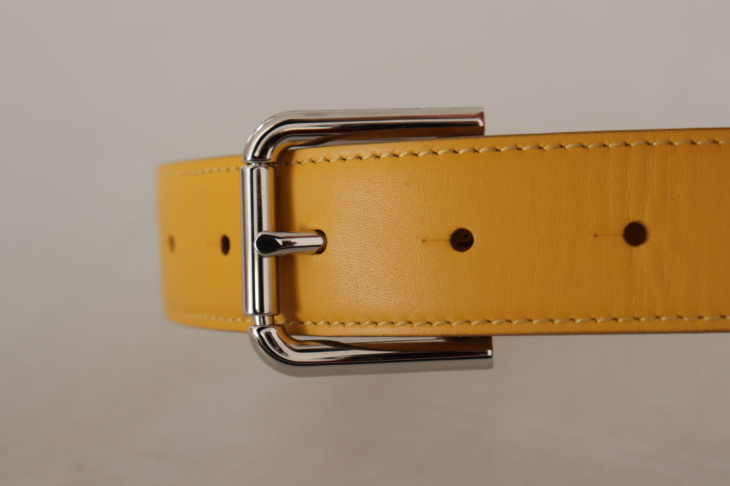 Yellow leather belt with silver-tone logo metal buckle by Dolce & Gabbana, featuring a stylish and sleek design.