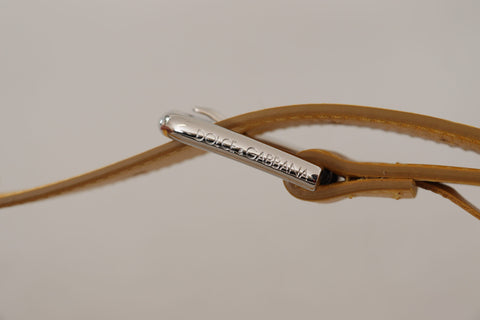 Yellow leather belt with silver-tone logo metal buckle by Dolce & Gabbana, showcasing a sleek design and polished finish.