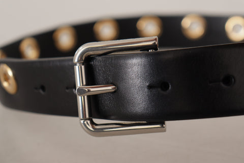 Black leather belt with silver eyelet and metal buckle by Dolce & Gabbana, featuring a sleek, stylish design.