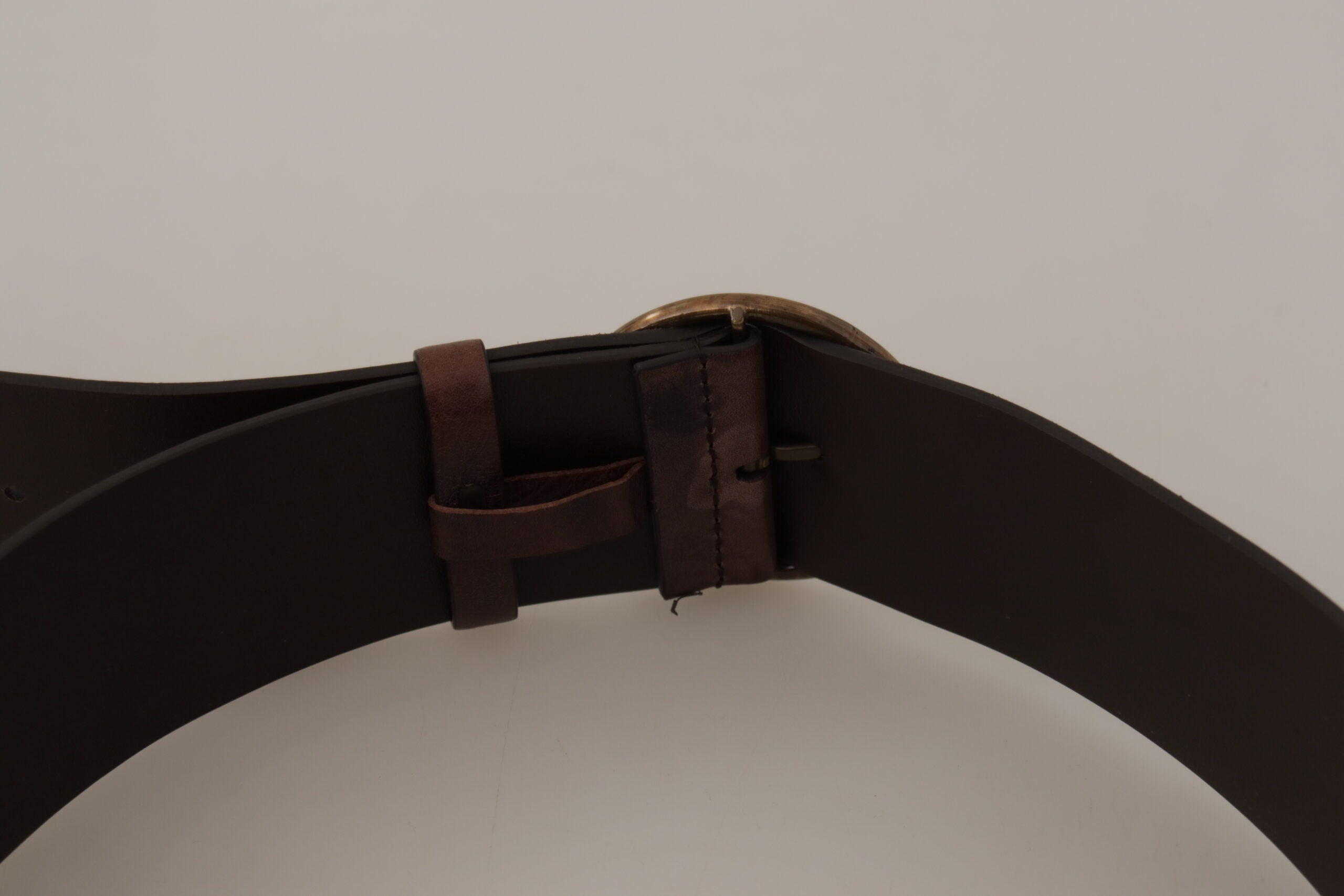 Dark brown leather wide calf belt with round buckle and Dolce & Gabbana logo, showcasing smooth textured leather and stylish design.