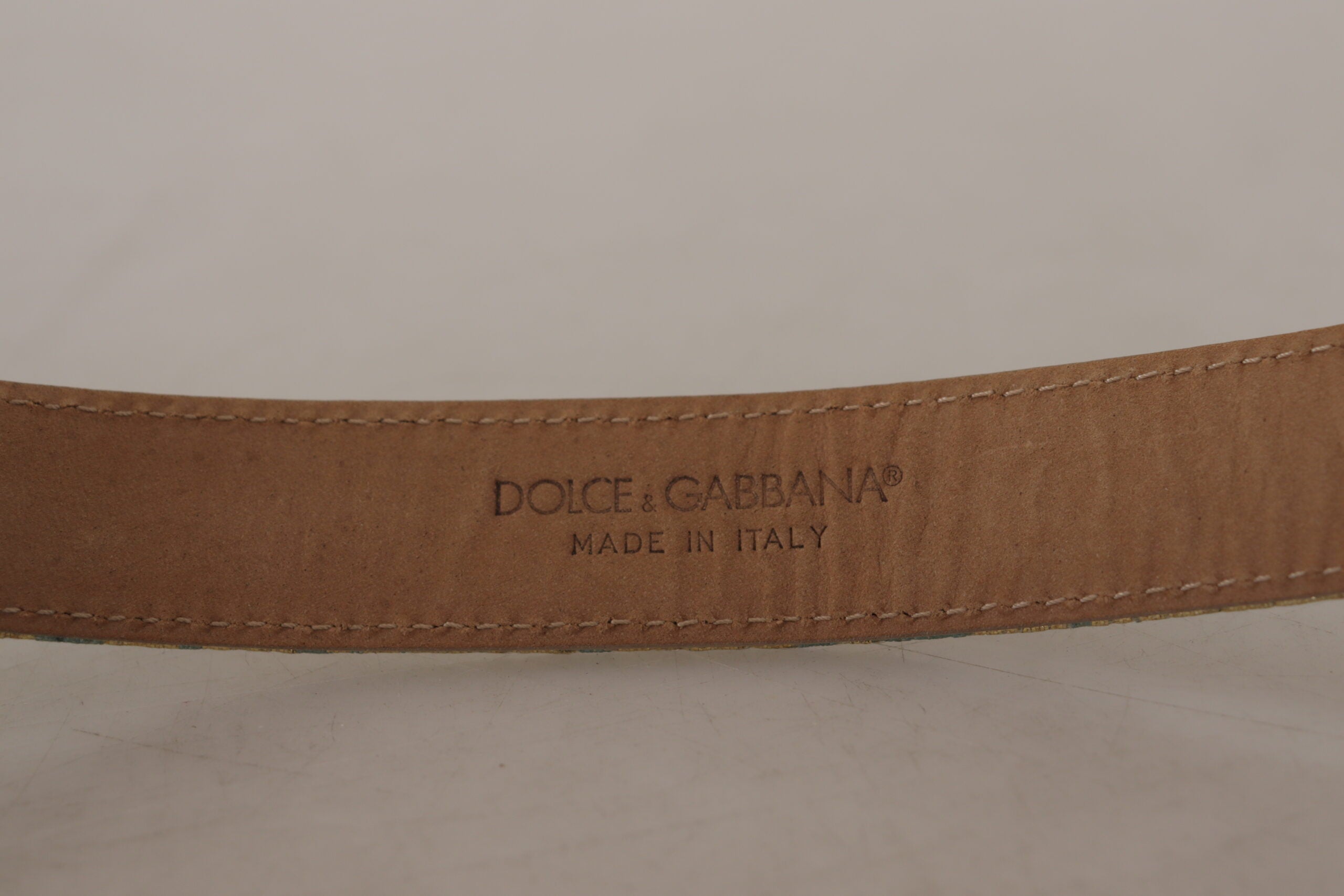 Blue leather jacquard embossed belt with gold metal buckle by Dolce & Gabbana, featuring intricate textured pattern and stylish design.